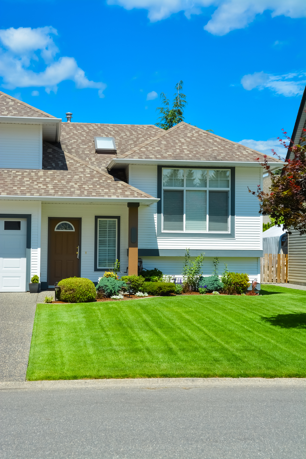 32665218_nice-lawn-and-entrance-of-beautiful-residential-house-on-sunny-day